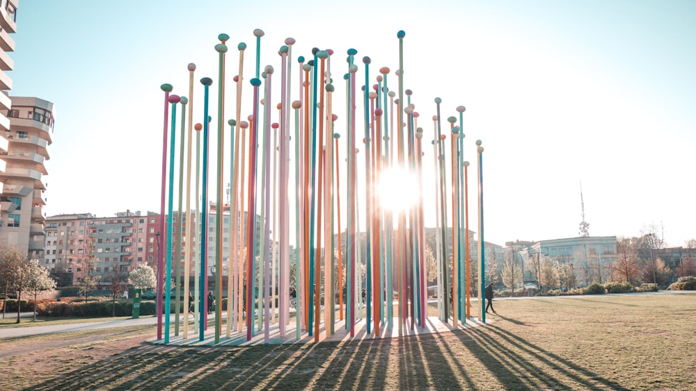 a group of poles that are in the grass