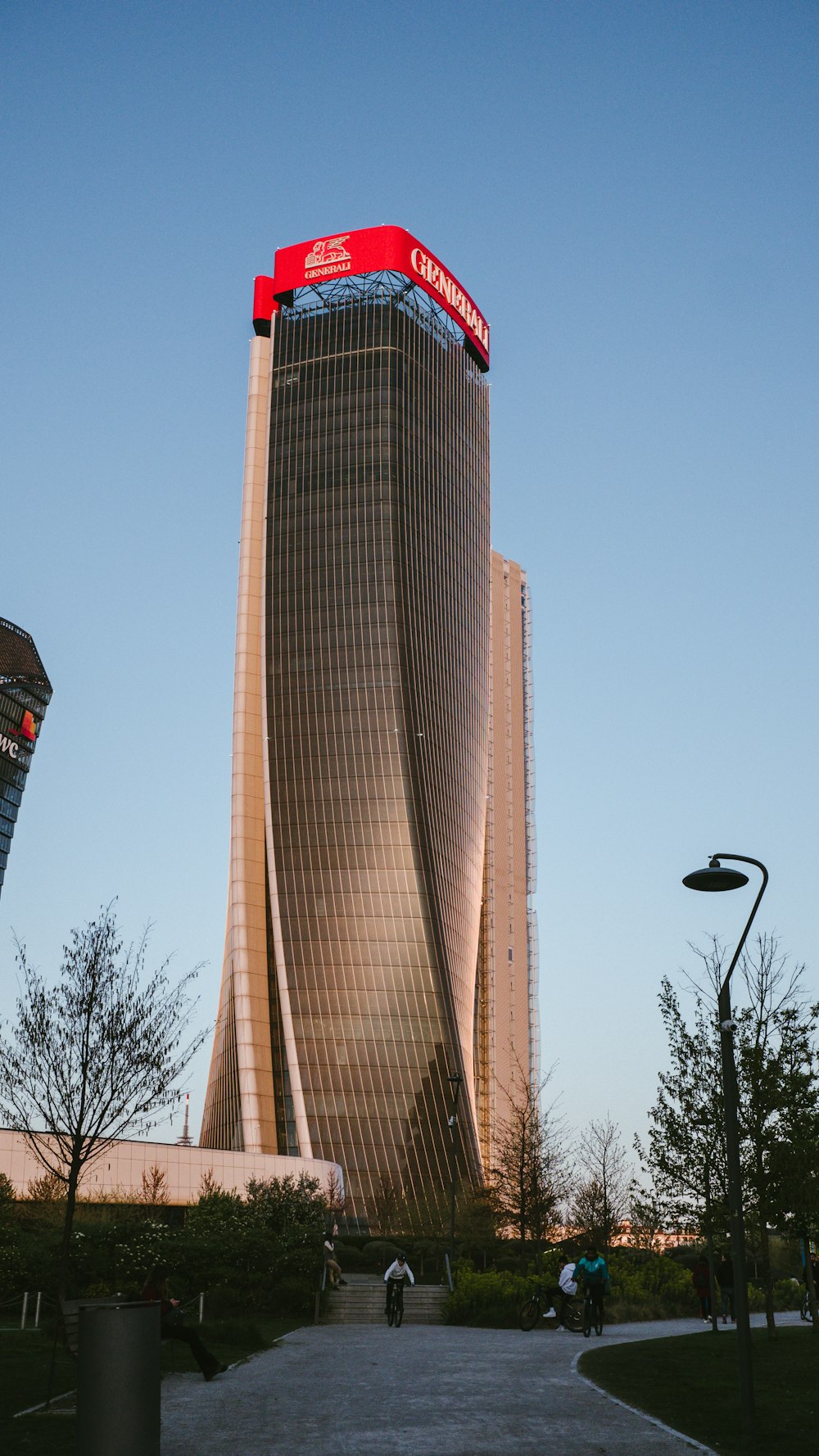 a tall building with a red sign on top of it