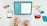 A person is using a tablet with a keyboard on a desk. The tablet displays a screen about search function design and considerations. Nearby, there is a smartphone showing some exploration and creation options. Various colorful cards and pens are scattered on the white surface.