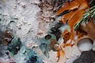 a close up of a piece of art with paint on it