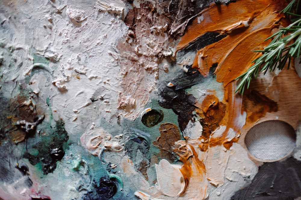 a close up of a piece of art with paint on it