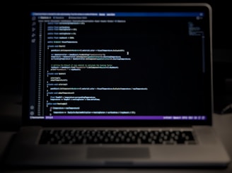 a laptop computer sitting on top of a desk