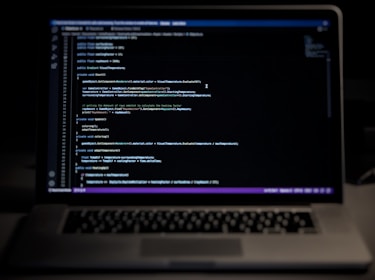 a laptop computer sitting on top of a desk