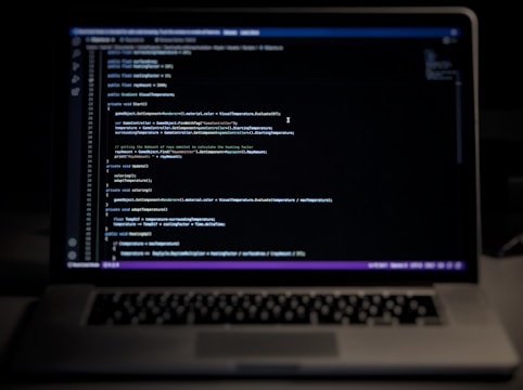 a laptop computer sitting on top of a desk