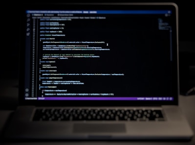 a laptop computer sitting on top of a desk