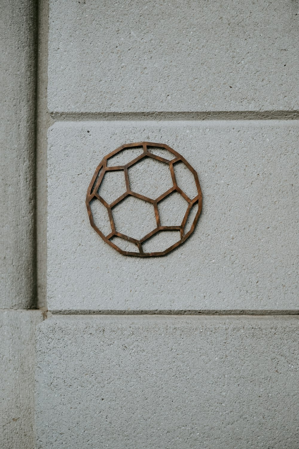 a circular object on the side of a building