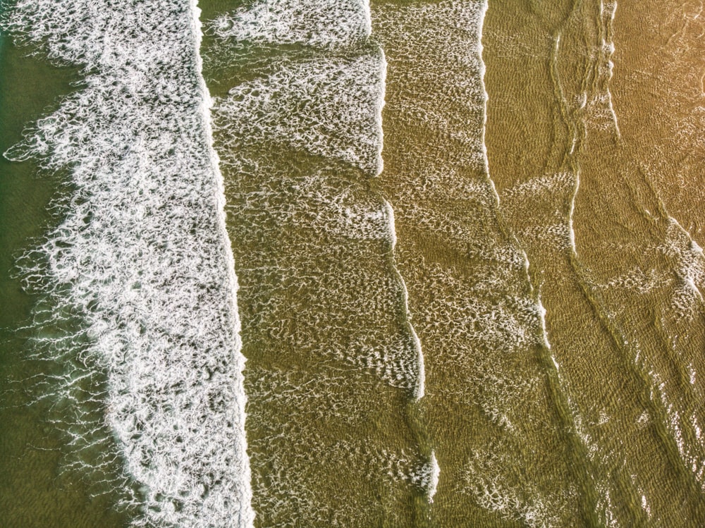 a bird's eye view of a beach and ocean