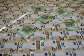 a pile of money sitting on top of a table