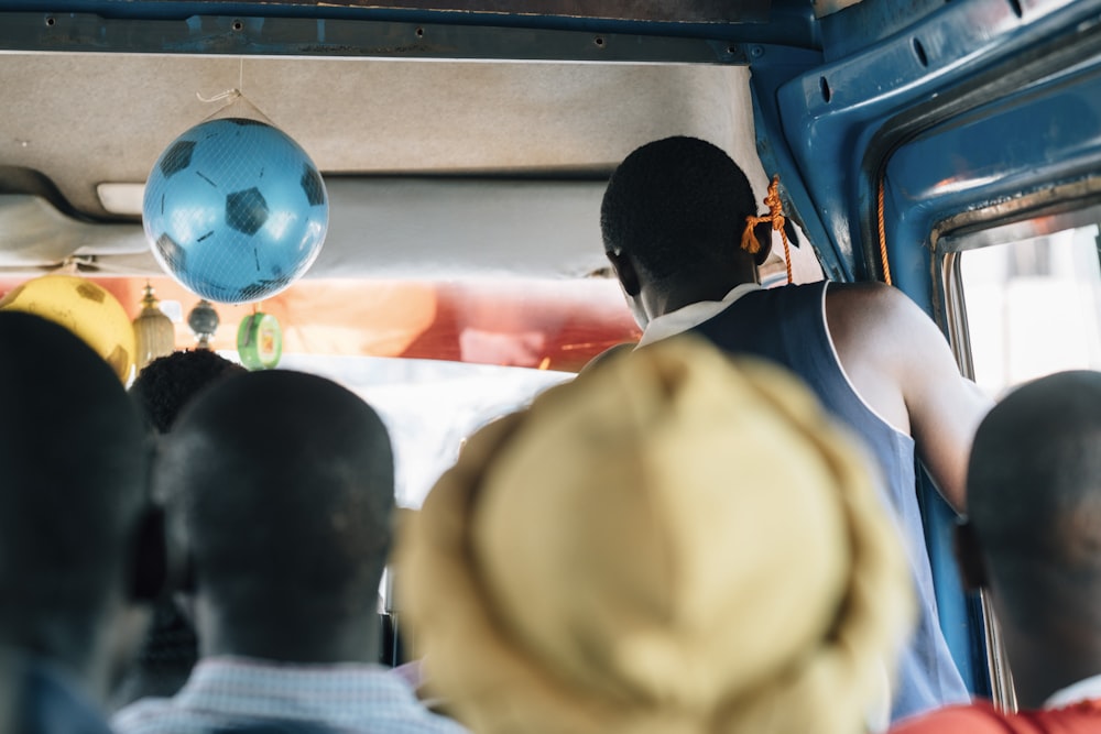 a group of people riding on a bus