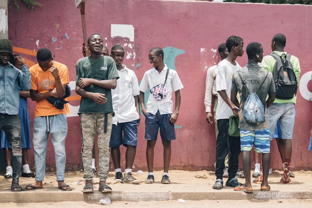 a group of young men standing next to each other