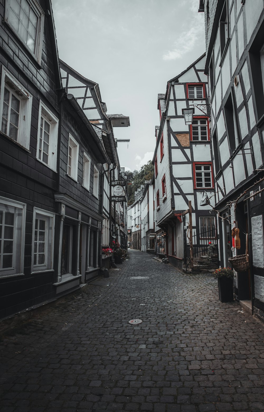 a cobblestone street lined with old buildings