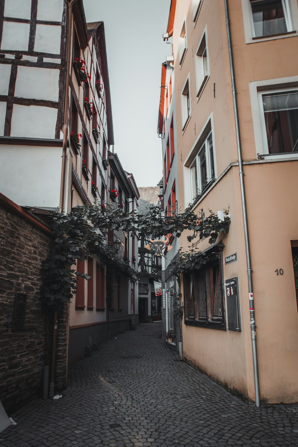 a narrow cobblestone street in a european city