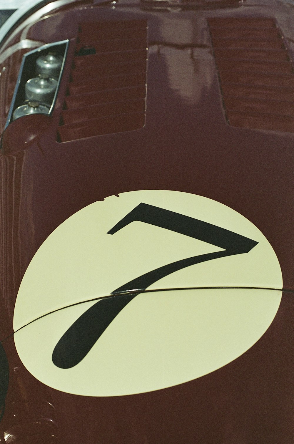 a close up of a number seven on the side of a car