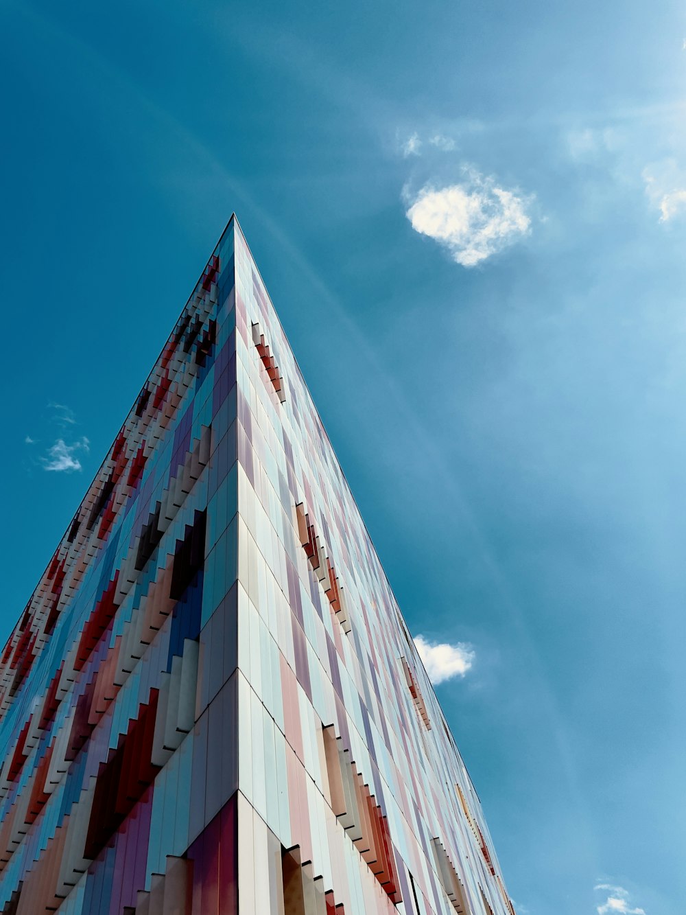 a very tall building with a sky background