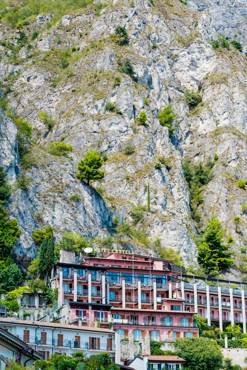 a very tall building sitting on the side of a mountain