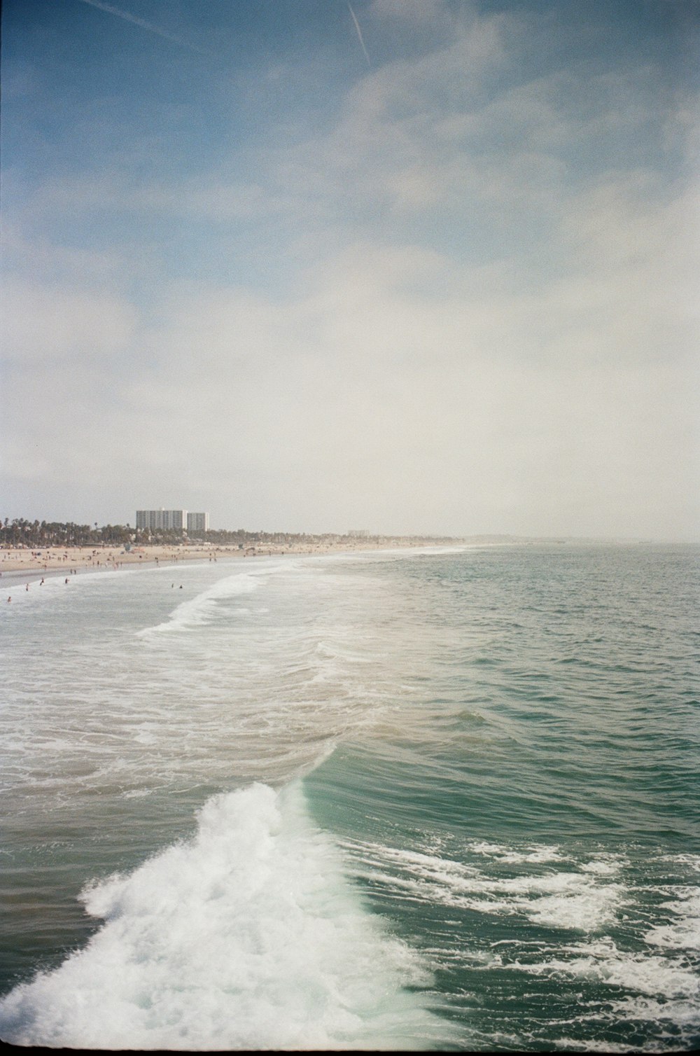 a man riding a wave on top of a body of water