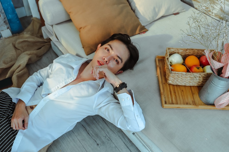 Man relaxing with fruit basket