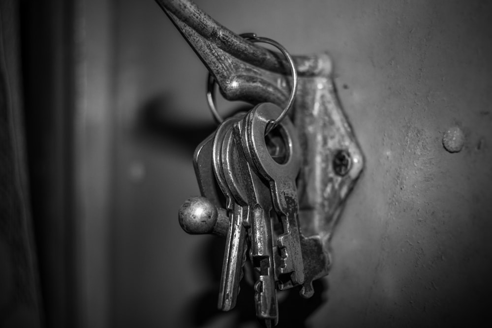 a bunch of keys that are hanging on a wall
