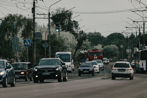 a street filled with lots of traffic next to power lines
