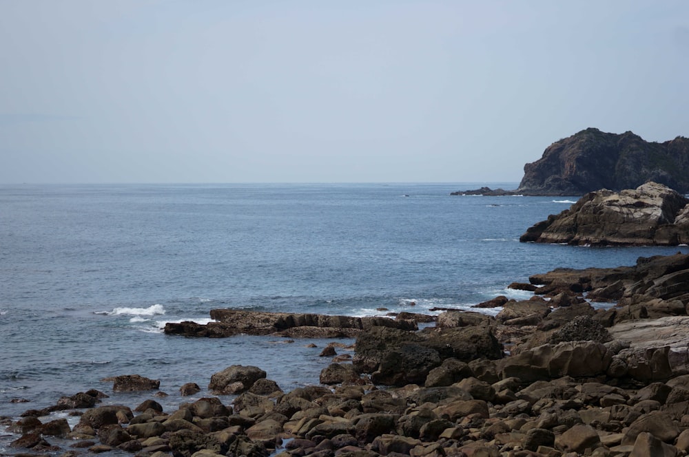 a large body of water surrounded by rocks