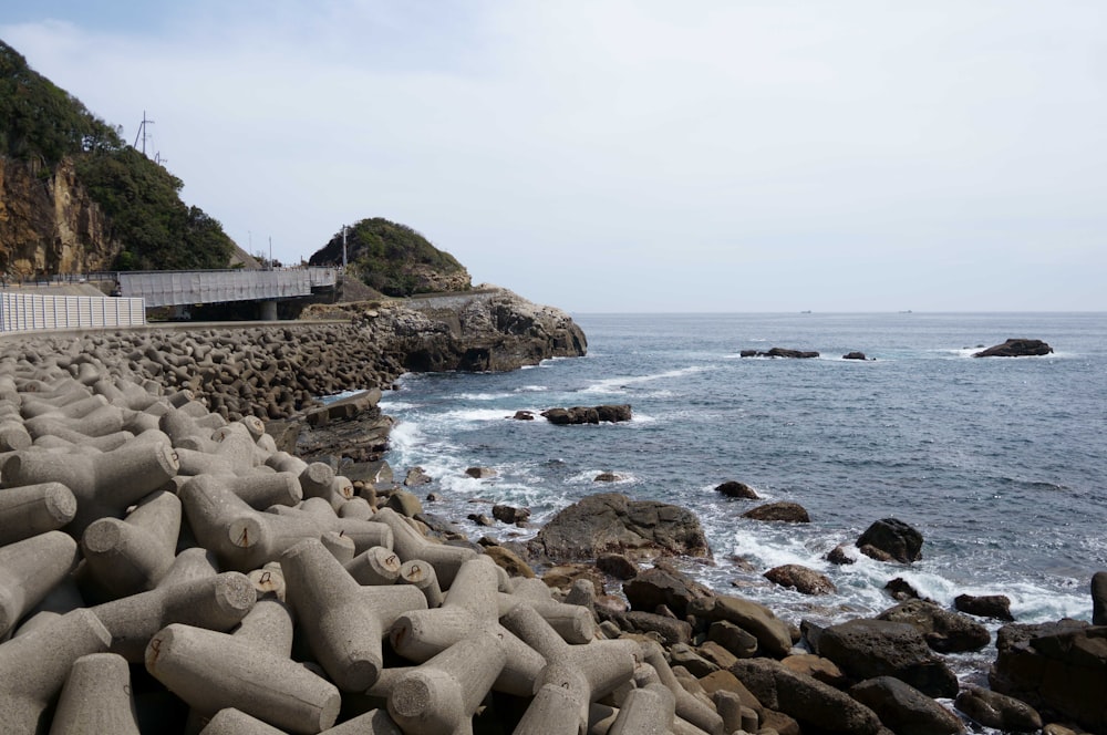 a view of the ocean from a rocky shore