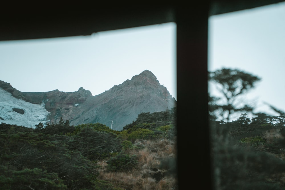 a view of a mountain through a window