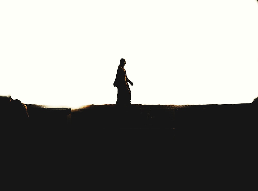 a person standing on top of a hill