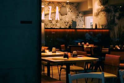 A cozy interior of a restaurant with dim lighting.