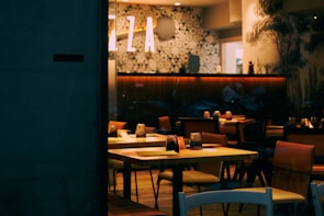 Cozy interior of Restaurante Fribel Ltda with warm lighting and inviting tables.