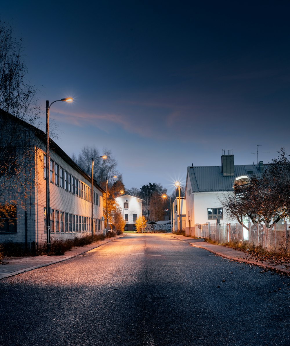 an empty street at night in a small town