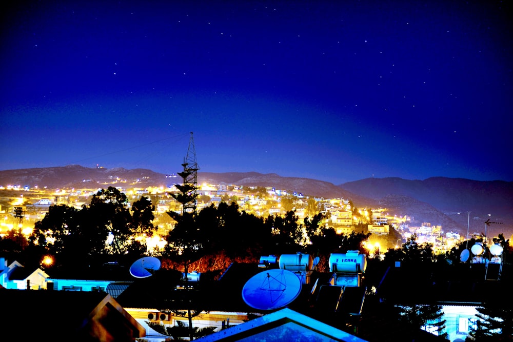 a view of a city at night from a rooftop