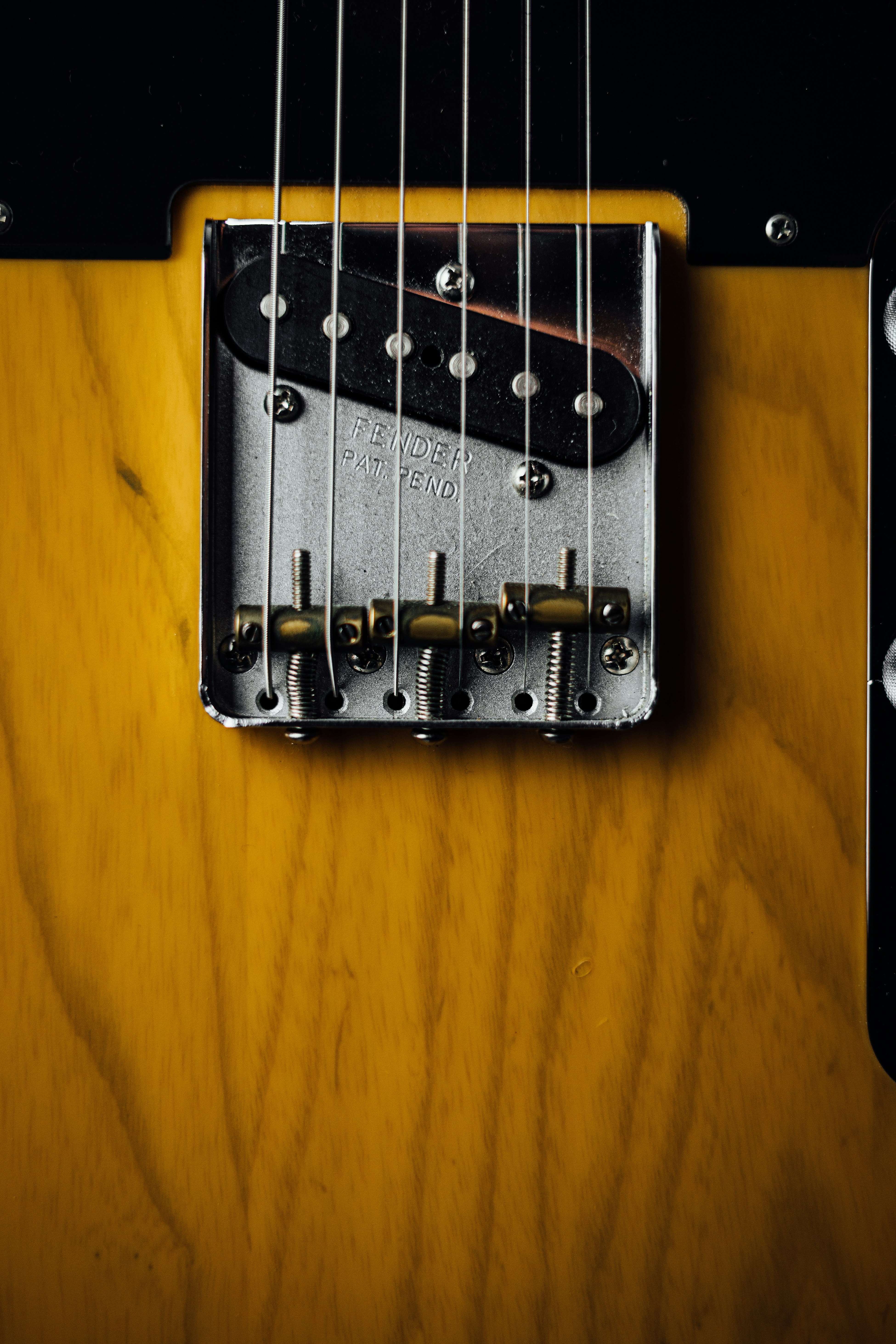 a close up of an electric guitar neck