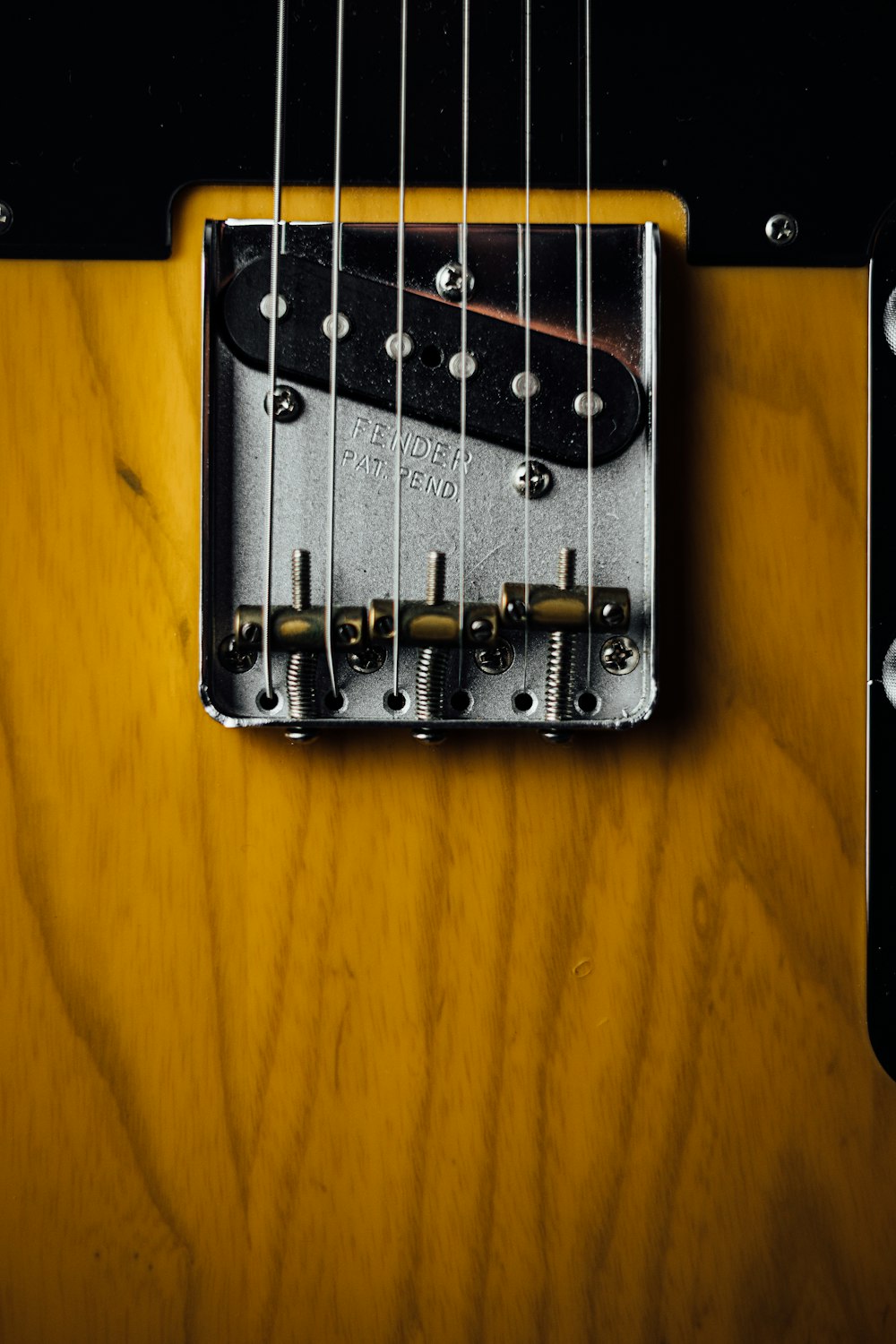 a close up of an electric guitar neck
