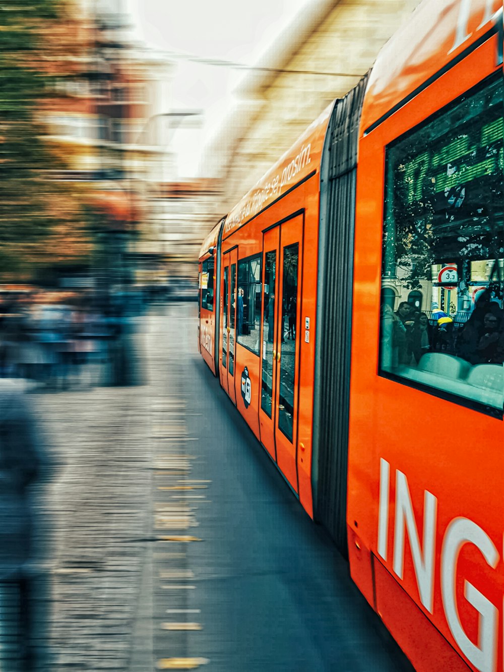 a blurry photo of a train on a city street