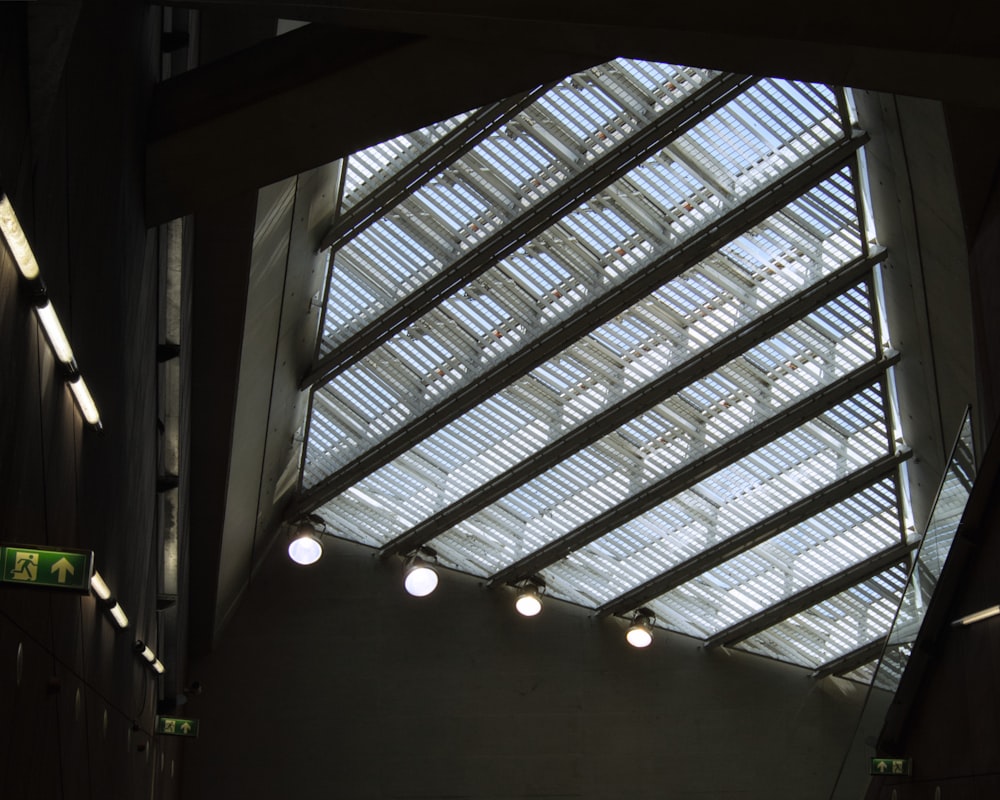 the ceiling of a building with several lights on it