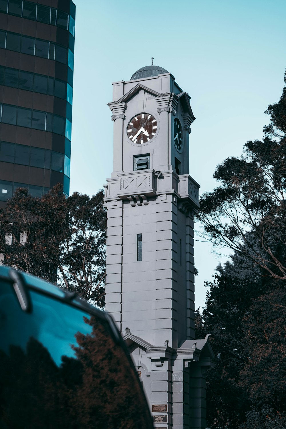 a tall clock tower with a clock on each of it's sides