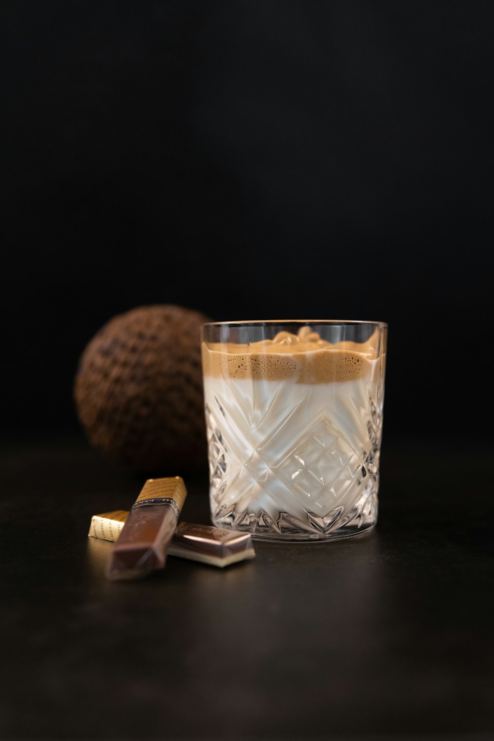 a glass with some chocolate on a table