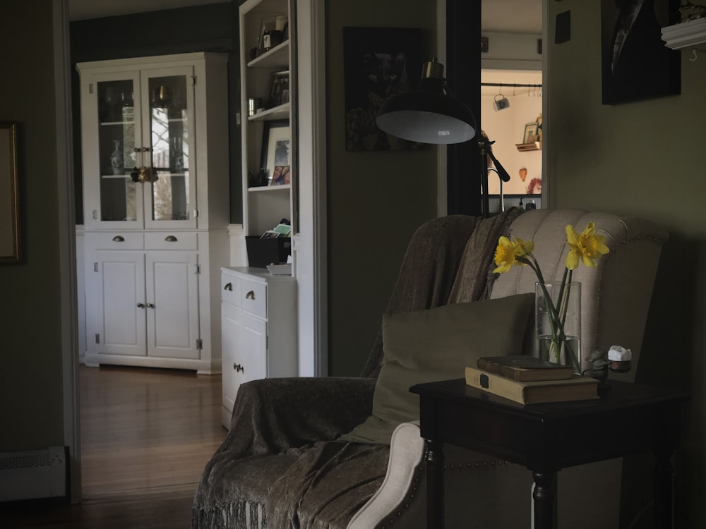 a living room with a chair and a table