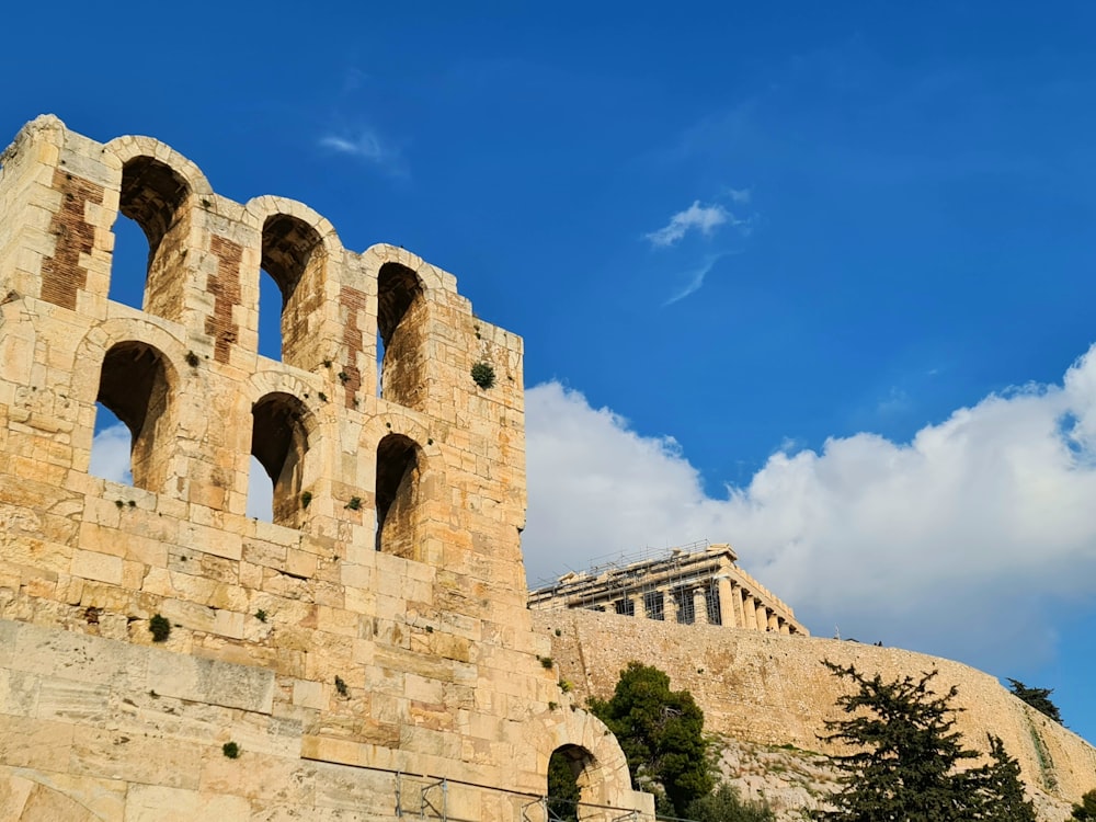 a large stone structure with a sky background