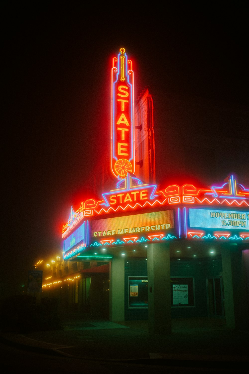 a large building with a neon sign on top of it