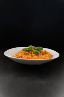 a white plate topped with macaroni and cheese