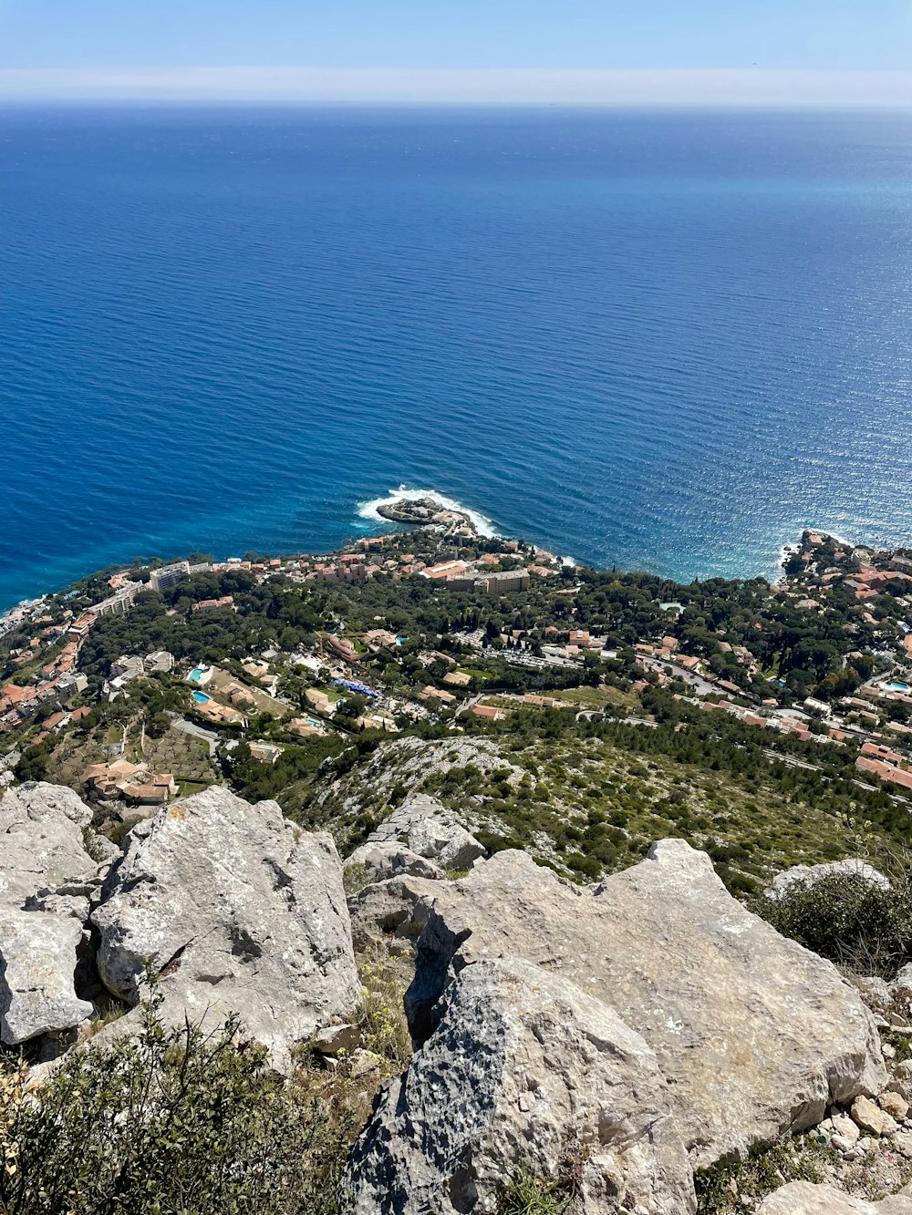 a view of the ocean from the top of a hill