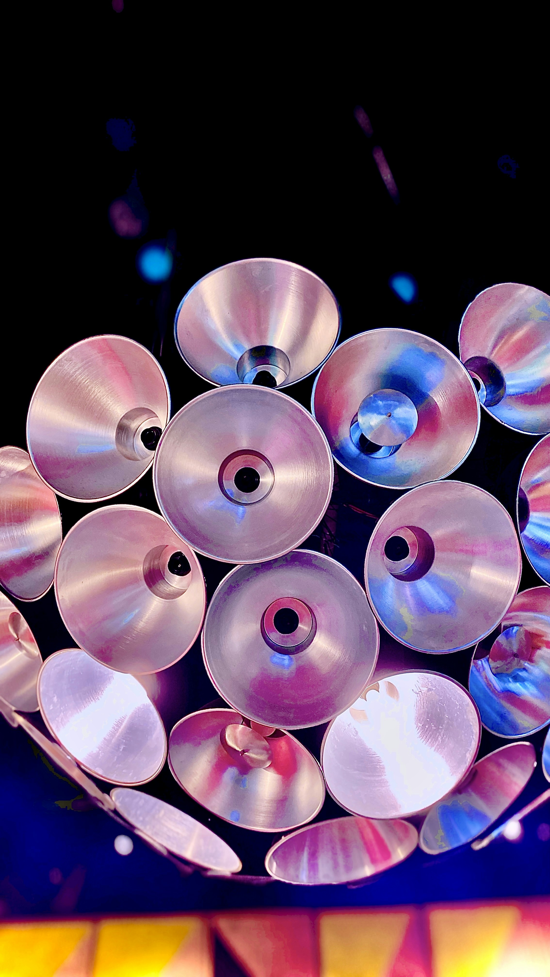 a bunch of discs that are hanging from a ceiling
