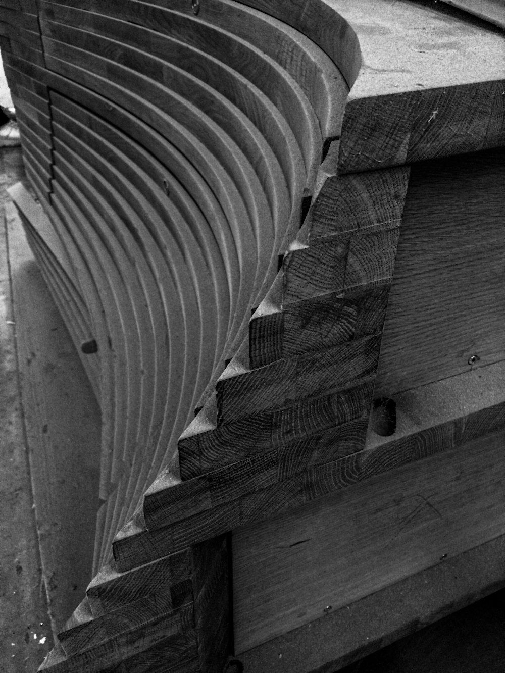 a close up of a boat on a wooden surface