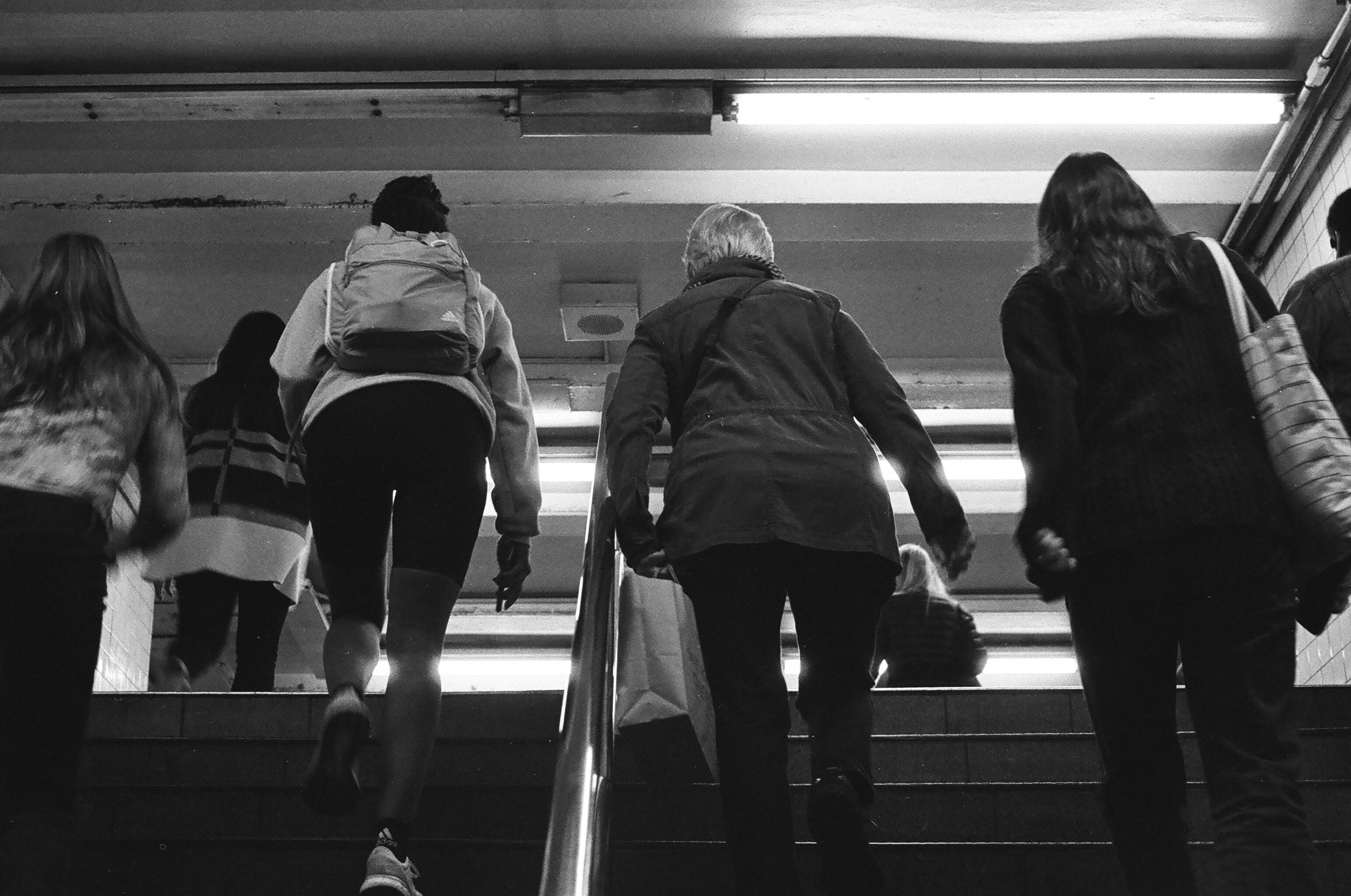 a group of people walking down a flight of stairs