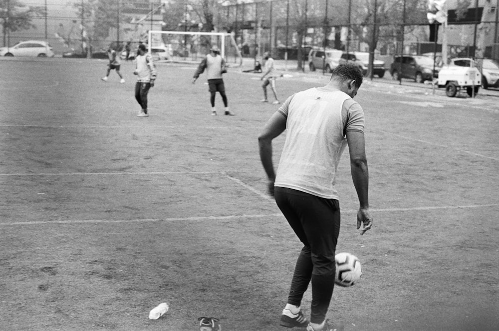 a group of men playing a game of soccer