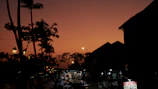 A vibrant street market scene captured during a sunset stroll.