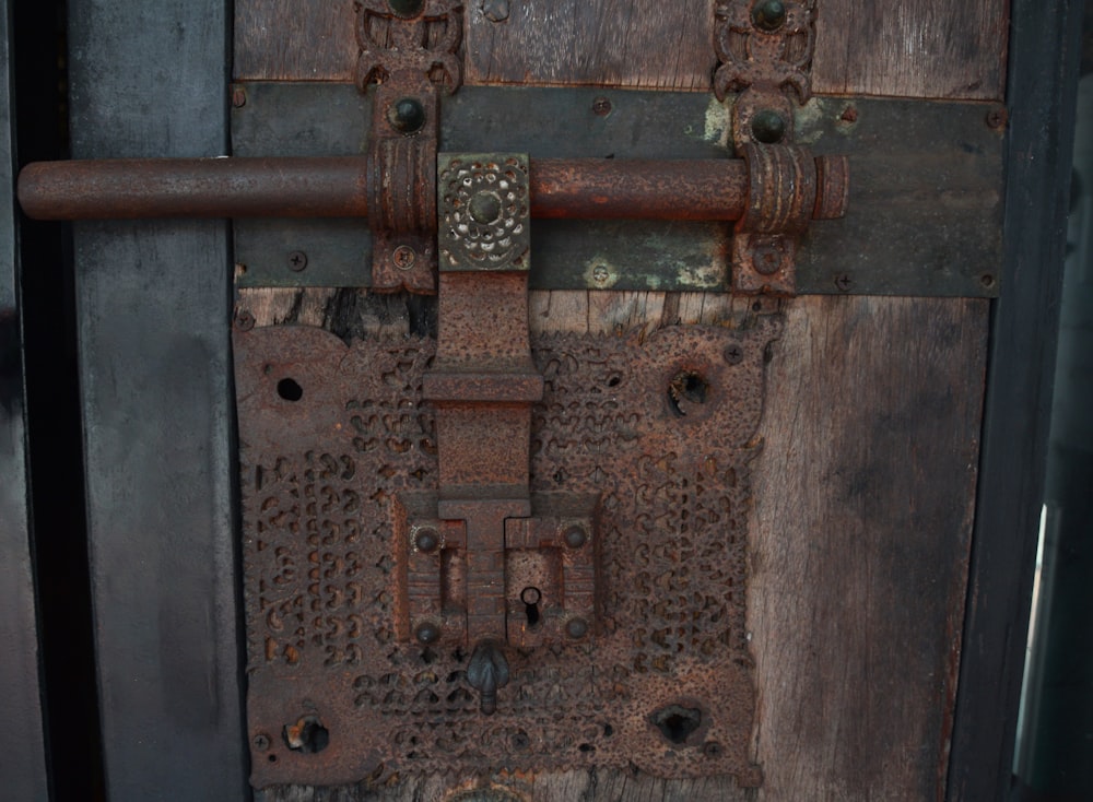 a close up of a metal door with a lock