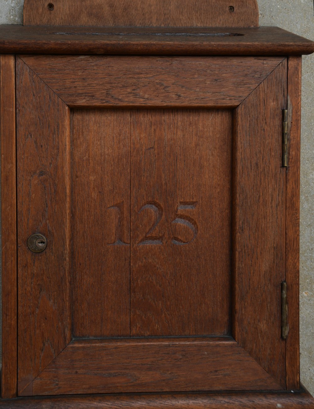 a close up of a wooden door with numbers on it