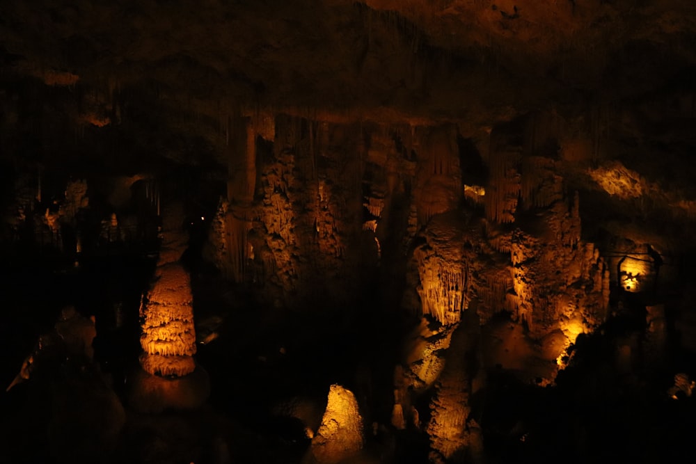 a cave filled with lots of lit up rocks